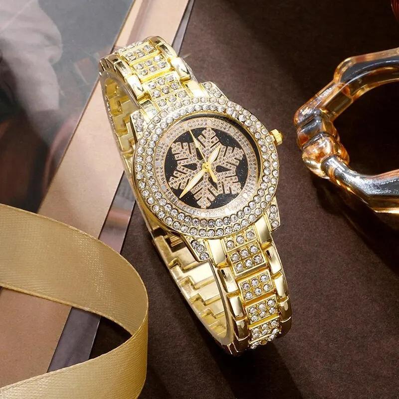 Montre à motif flocon de neige incrustée de strass pour femmes
